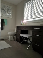 modern bathroom and counter with dark drawers