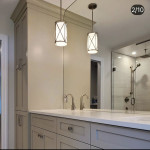 bathroom vanity with counter-to-ceiling mirror and pendant light