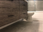 bathroom counter with wood drawers