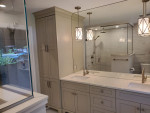 bathroom with double-sink vanity and counter-to-ceiling mirror