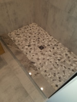 raised bathroom shower with floor tiles