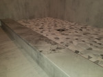 raised bathroom shower with floor tiles
