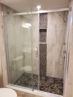 bathroom shower with tile accent
