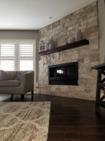 family room with floor to ceiling brick fireplace and wood mantel and wood flooring