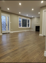 family room with wood flooring and pot lights