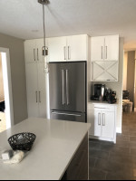 kitchen with center island, stainless steel appliances, and pendant light