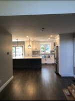 kitchen with dark wood flooring and white cabinets