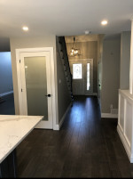 kitchen with dark wood flooring and glass basement door