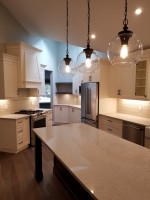 three glass pendant lights above kitchen island