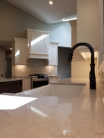 kitchen with recessed sink and black faucet