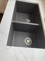 dual recessed kitchen sink and granite countertop